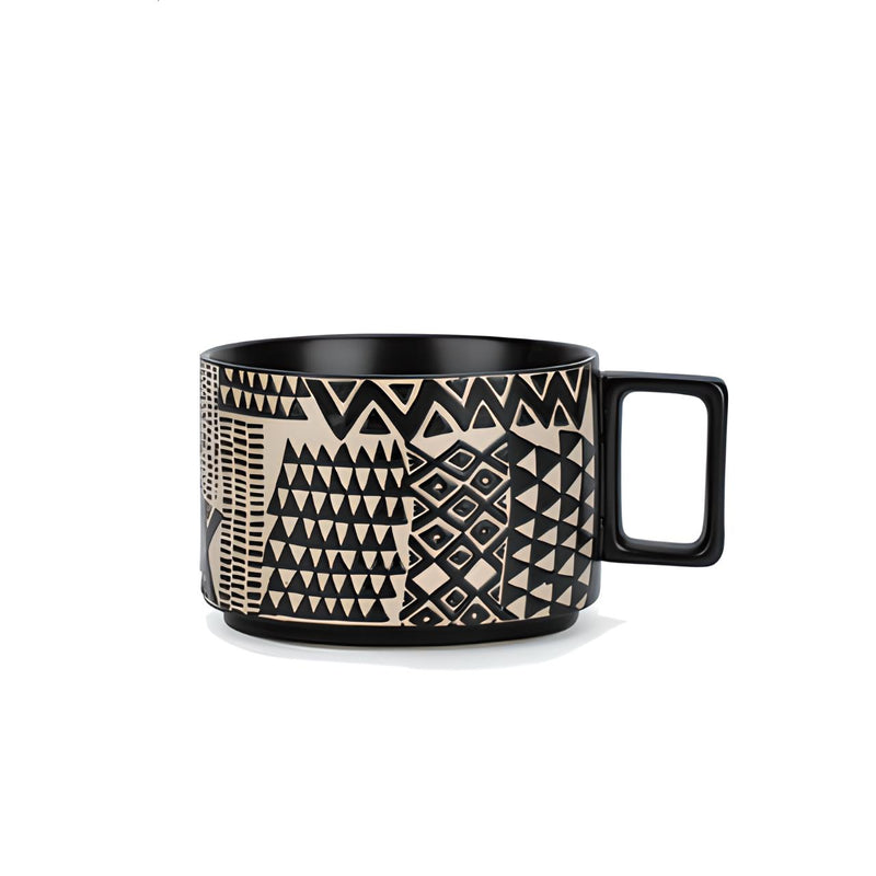 Black coffee cup with white pattern, African style. | Svart kaffekopp med vitt mönster, afrikansk stil.