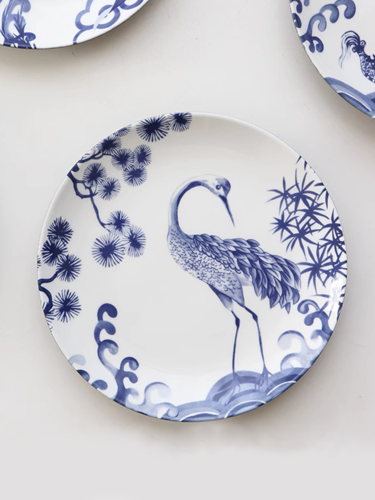 Blue and white crane plate, nature and flower pattern. | Blå och vit kranplatta, natur- och blommönster.