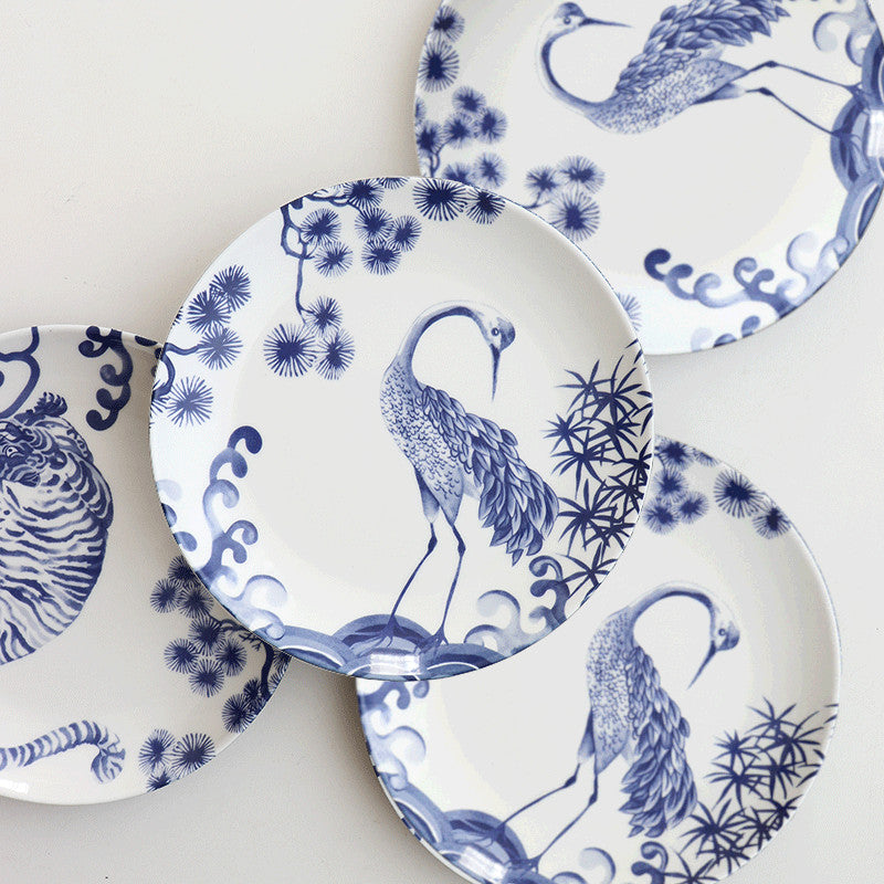Collection of blue crane plates, animal designs. | Samling blå kranplattor, djurdesign.