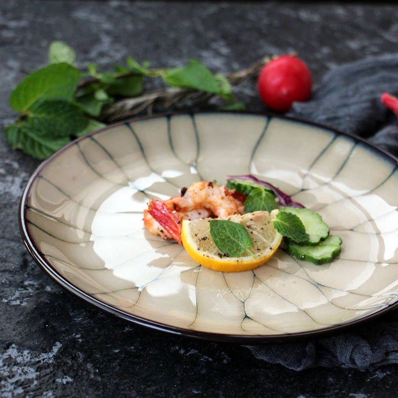 Sophisticated seafood dish, cracked plate, herbs, garnishes." | Finsk gourmeträtt, sprucken tallrik, örter, garneringa
