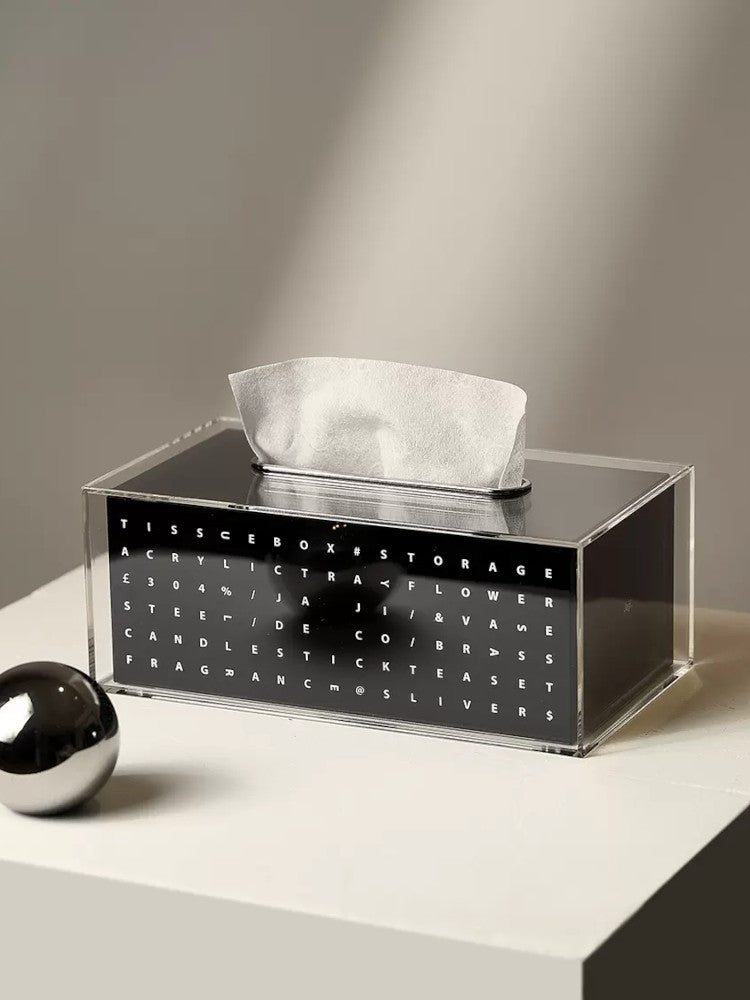 Black acrylic tissue box on simple background. | Svart akryl näsduksask på enkel bakgrund.